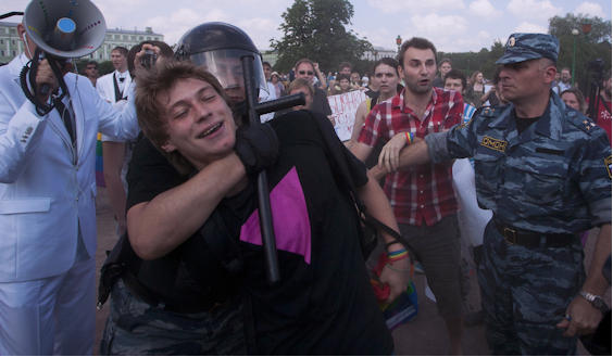 A pro-LGBT protestor is detained by police forces at a recent rally in St. Petersburg, Russia.